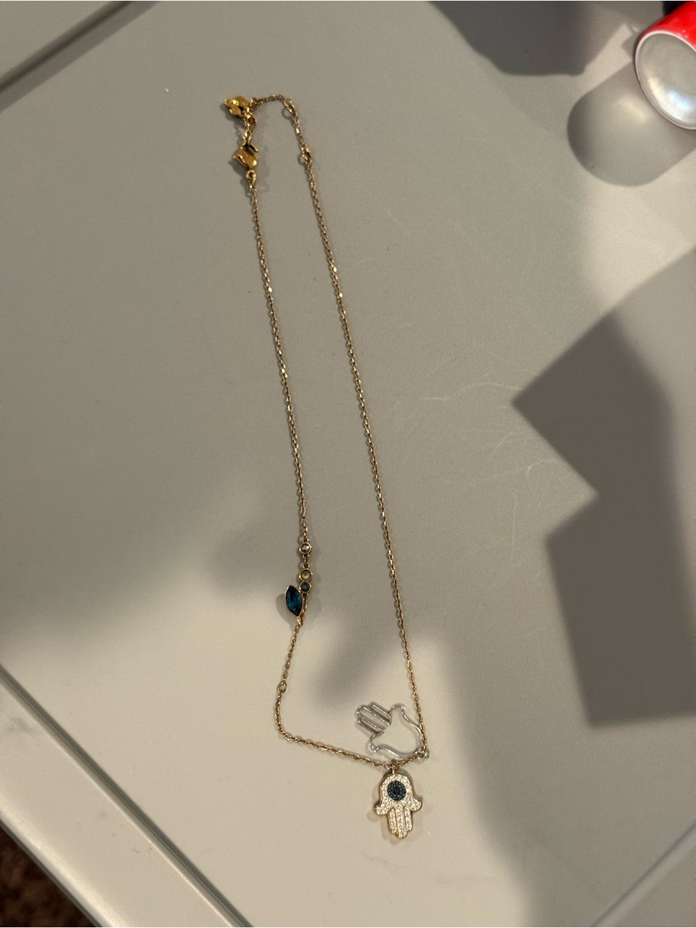 Swarovski Gold Hamsa Necklace with Blue Accents